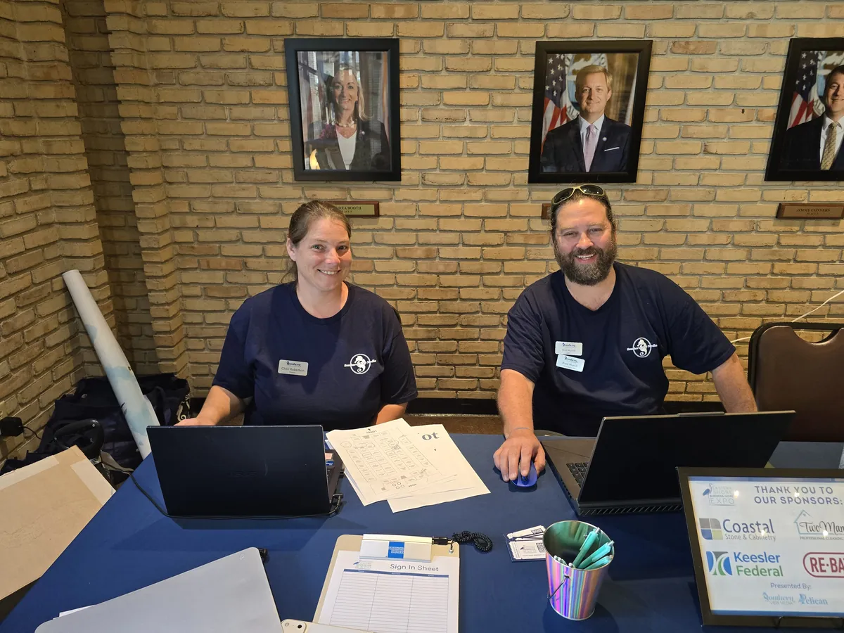 Southern View Media staff greet guests at an event registration table
